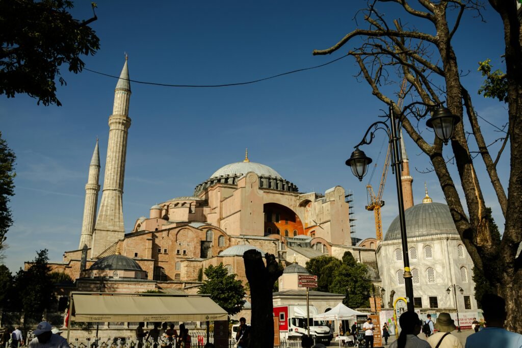Istanbul – Where Continents Meet Stunning view of Hagia Sophia in Istanbul, showcasing its majestic architecture under a clear blue sky.